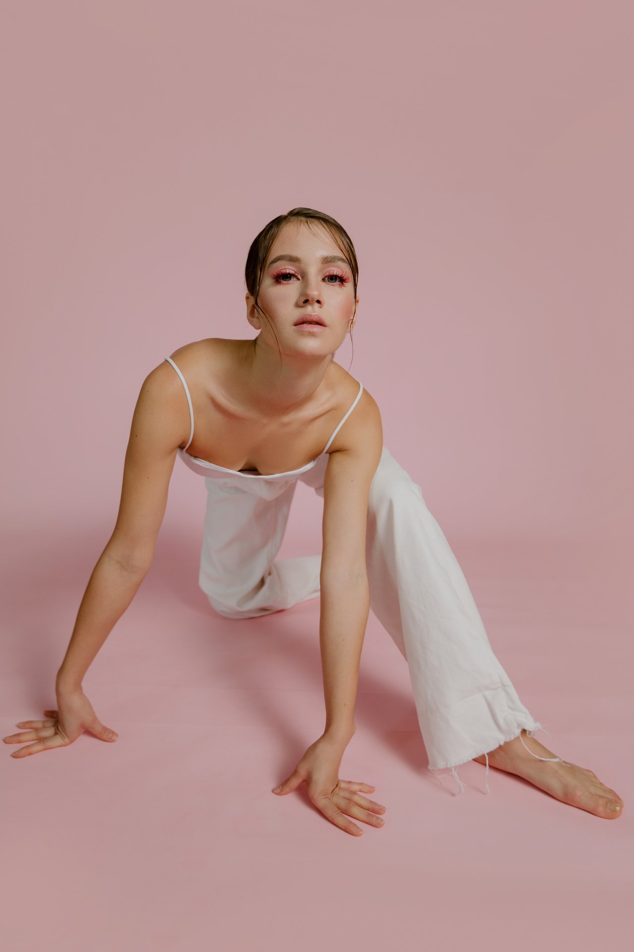 Gymnast Posing on Pink Studio Background